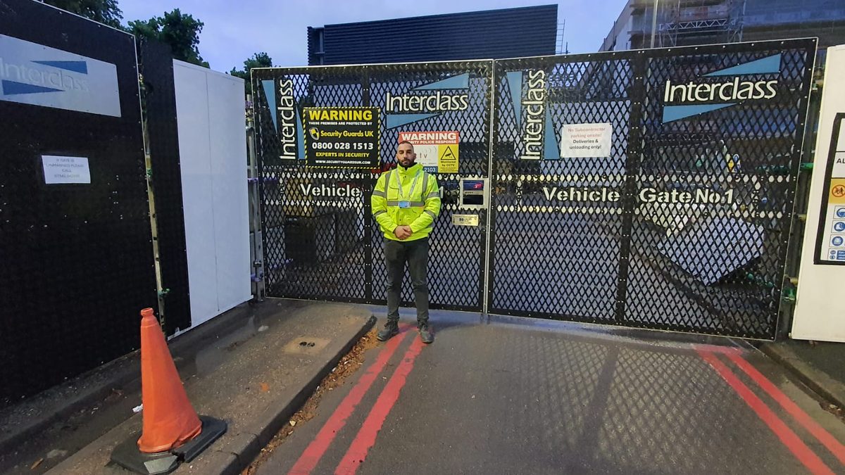 Security Guards UK officer controlling access at a site vehicle gate